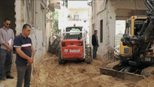 A group of men stand in a construction zone