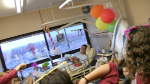 a man lays in a hospital bed